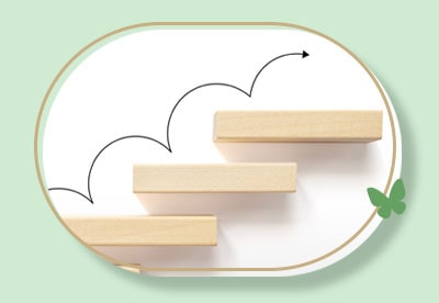 foto de uma seta subindo uma série de degraus, um a um